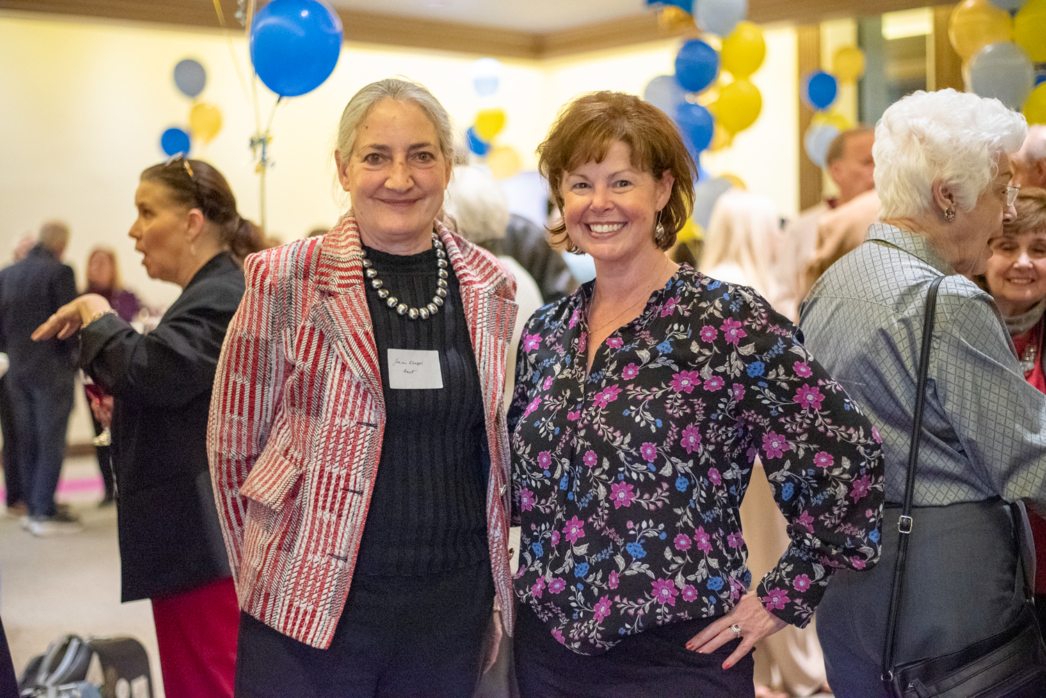 Competition guests posing together at a reception